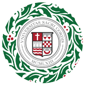 a Christmas wreath with the Sacred Heart University seal