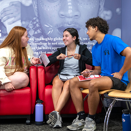 three people chatting