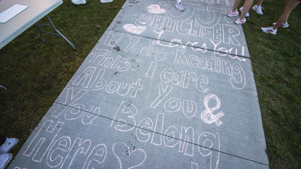 Sidewalk with inspirational quotes written in chalk