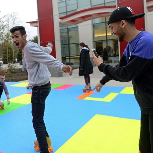 Students roller skating outside
