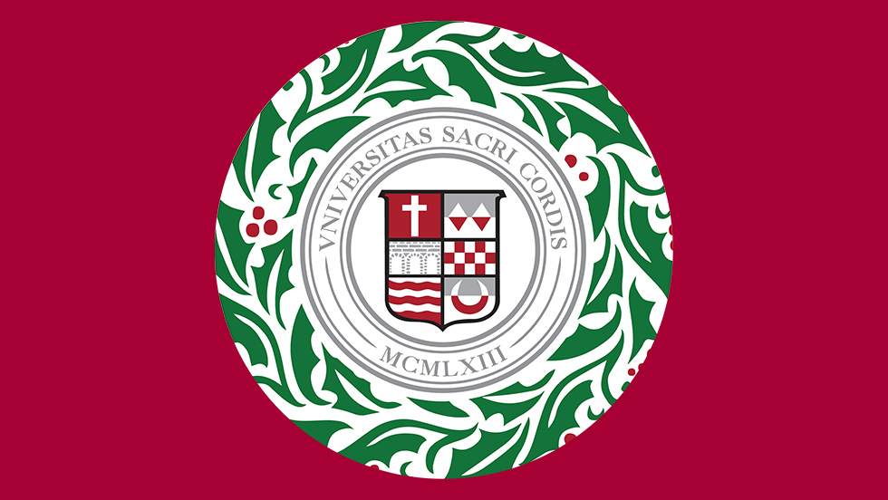 Christmas wreath with the Sacred Heart University seal