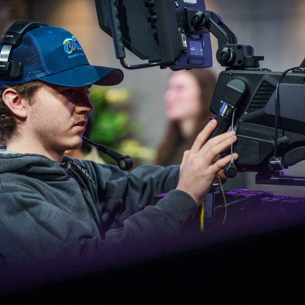 Student operating camera