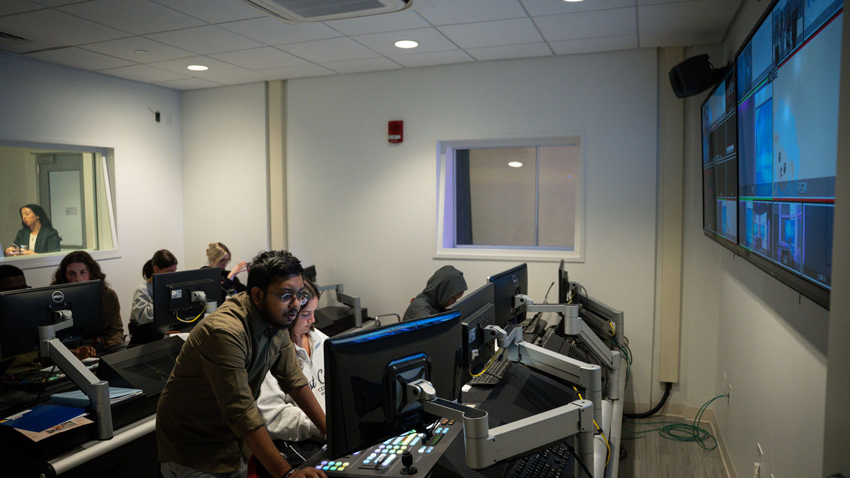 Students working on computers in control room