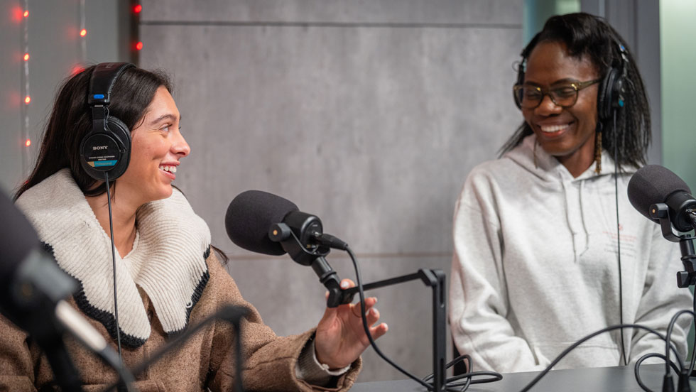 Two students recording in a studio