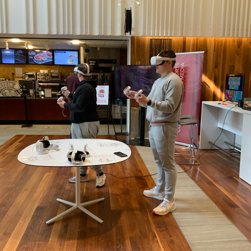 Students using VR in Martire Atrium