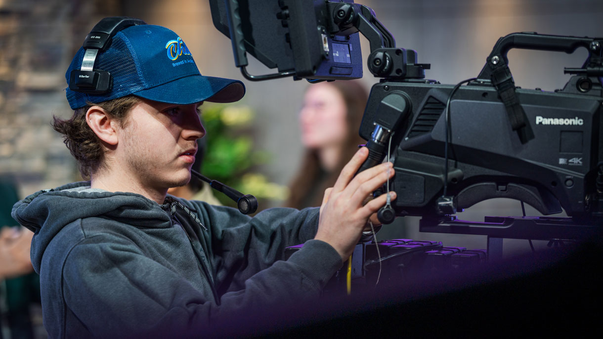 Student operating camera