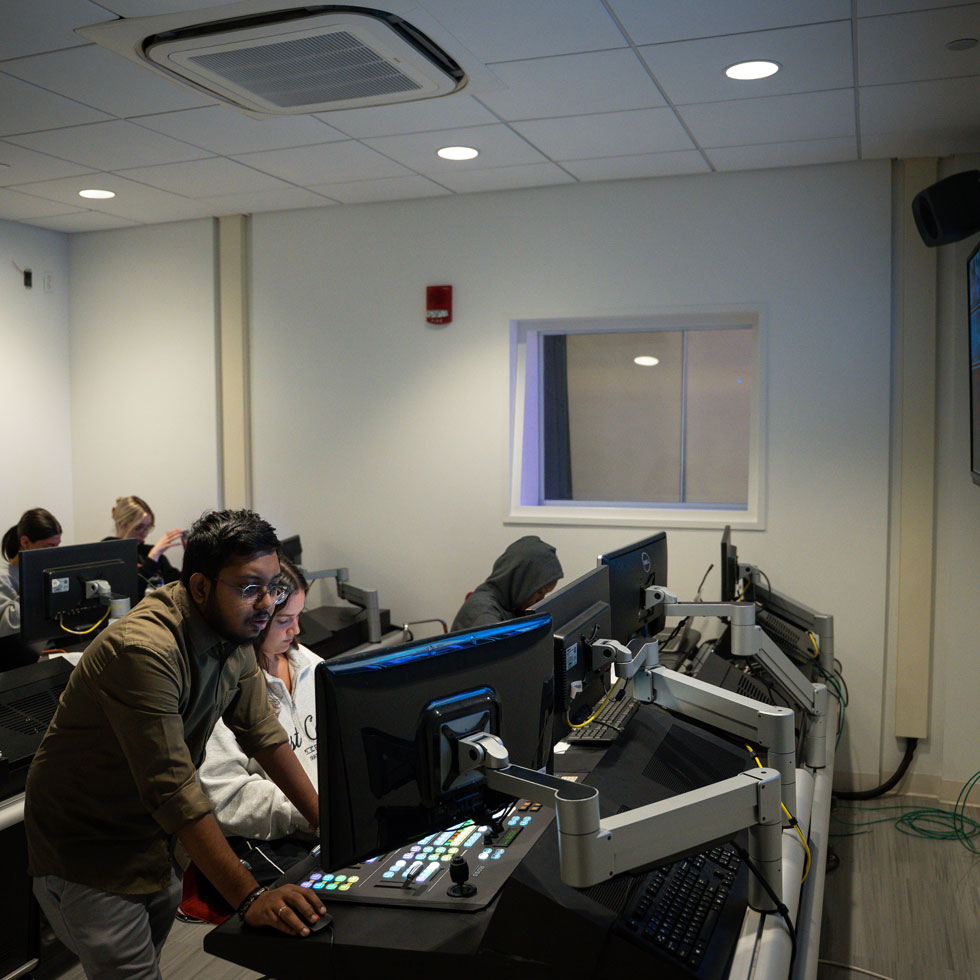 Students working on computers in control room