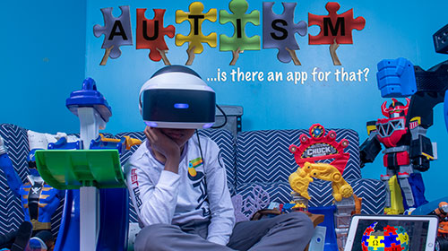 Child with an ipad graphic text: autism is-there an app for that