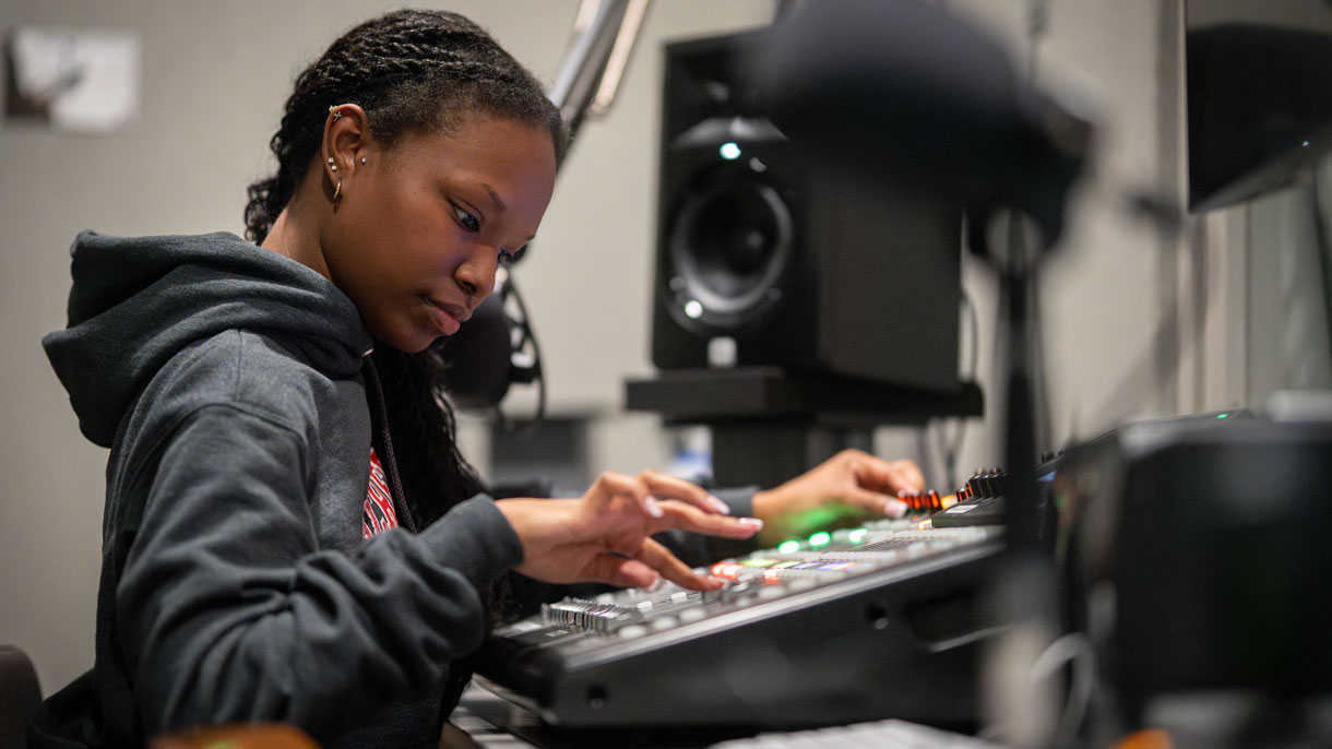 Student using equipment in studio