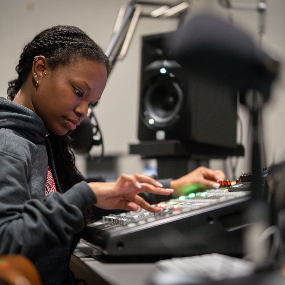 Student using equipment in studio
