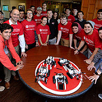 students standing with bots they made
