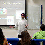 man presenting to students