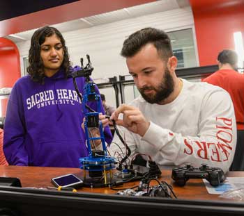 Students working on robot in AI Lab