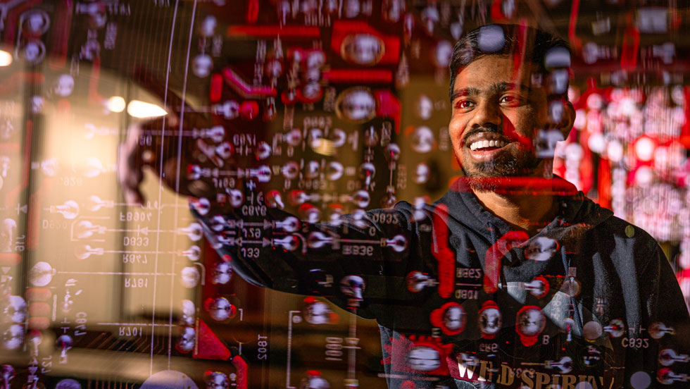 Student looking at code