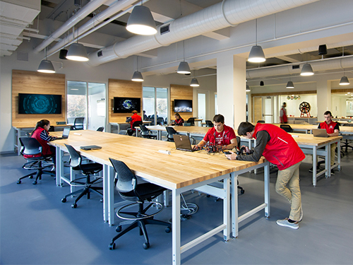 college students collaborating in a makerspace