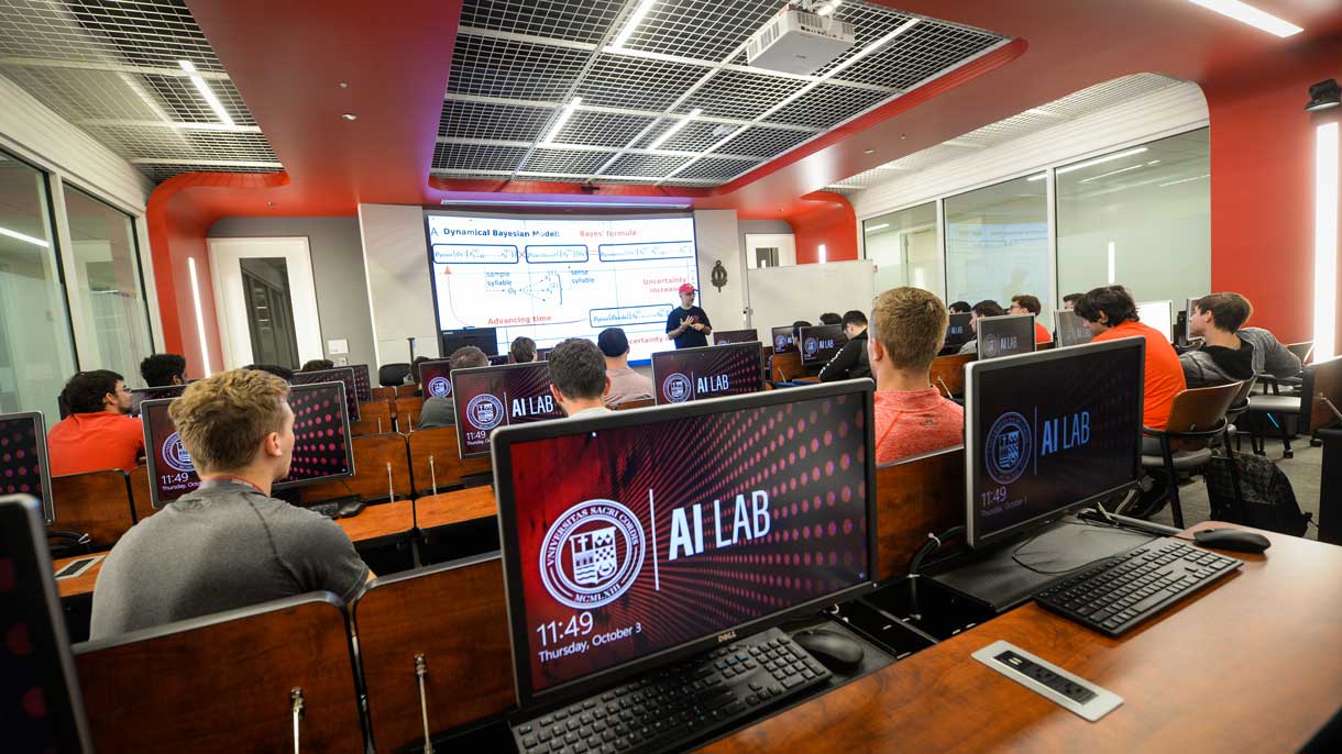 Students listening to professor in AI Lab