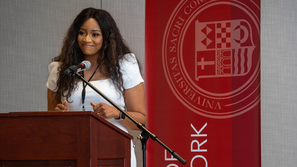Woman smiling at podium