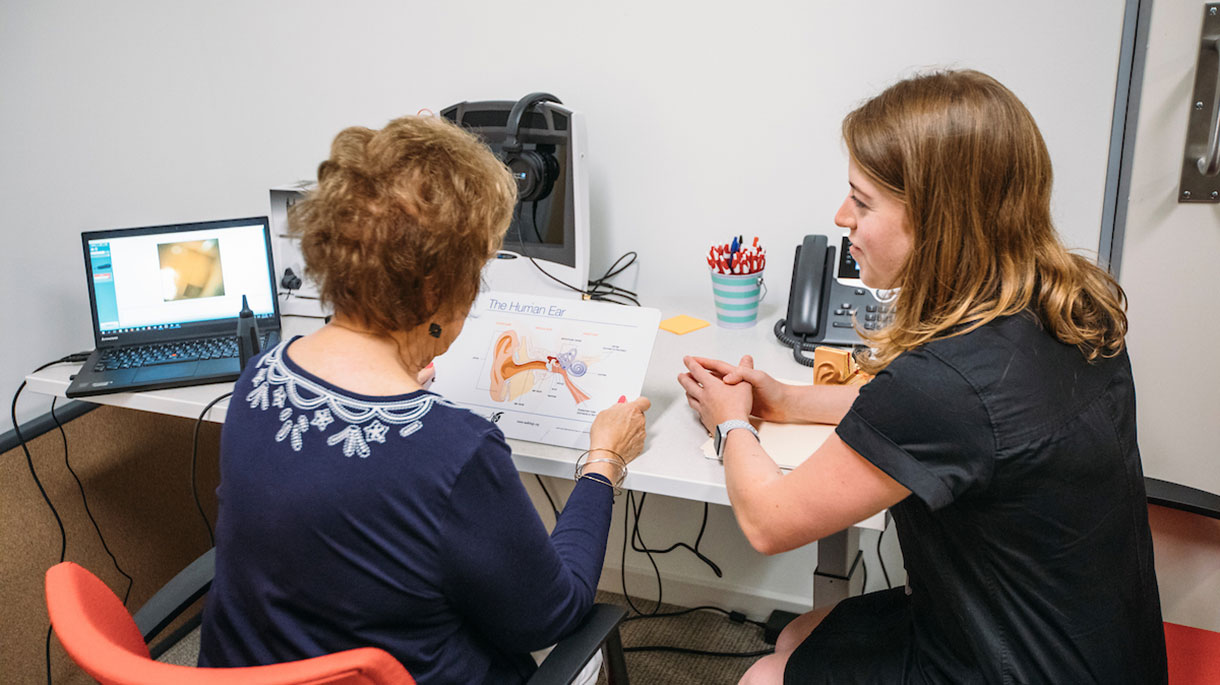 Student learning to give an ear exam