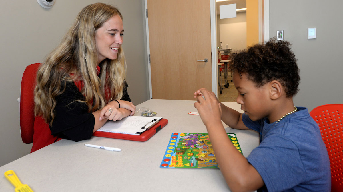 speech language pathology student working with a child