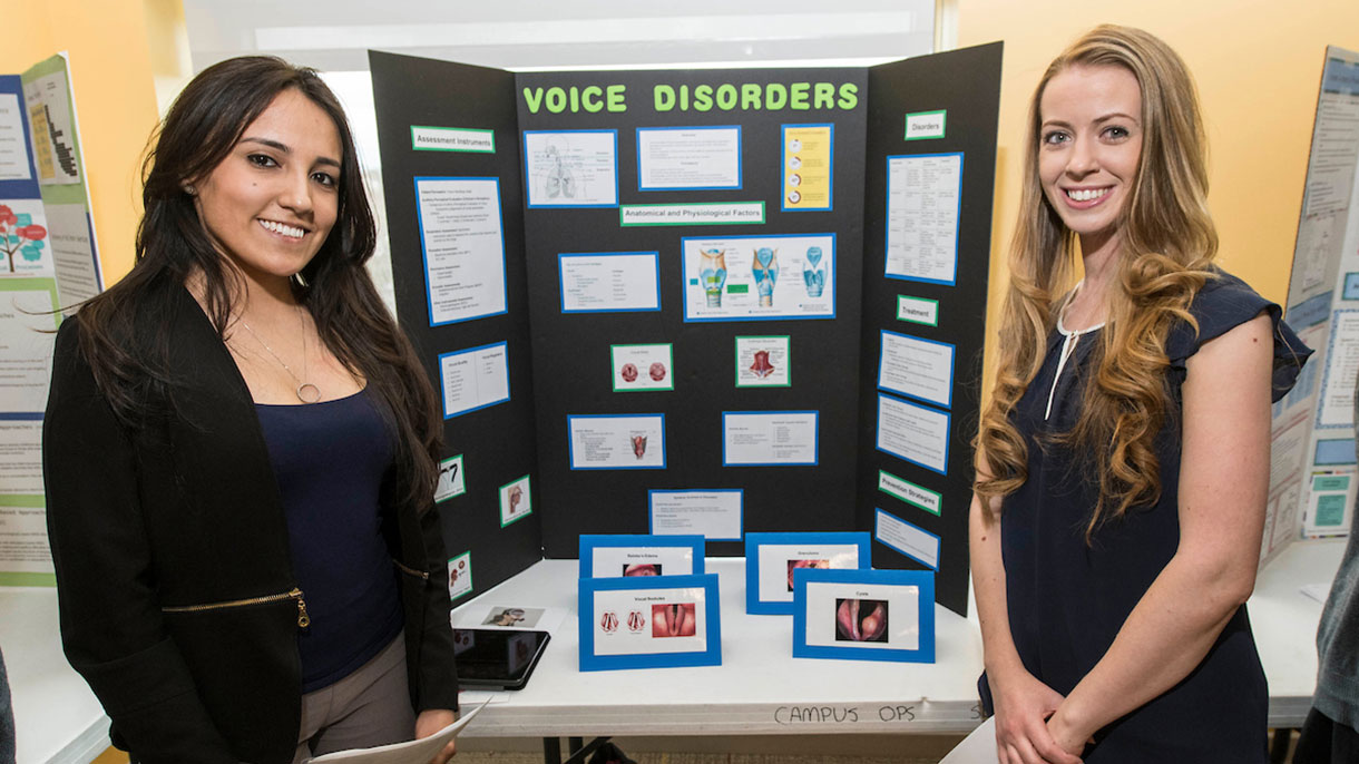 two student giving a presentation 