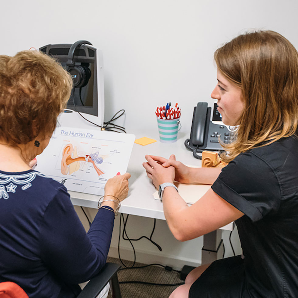 Student learning to give an ear exam