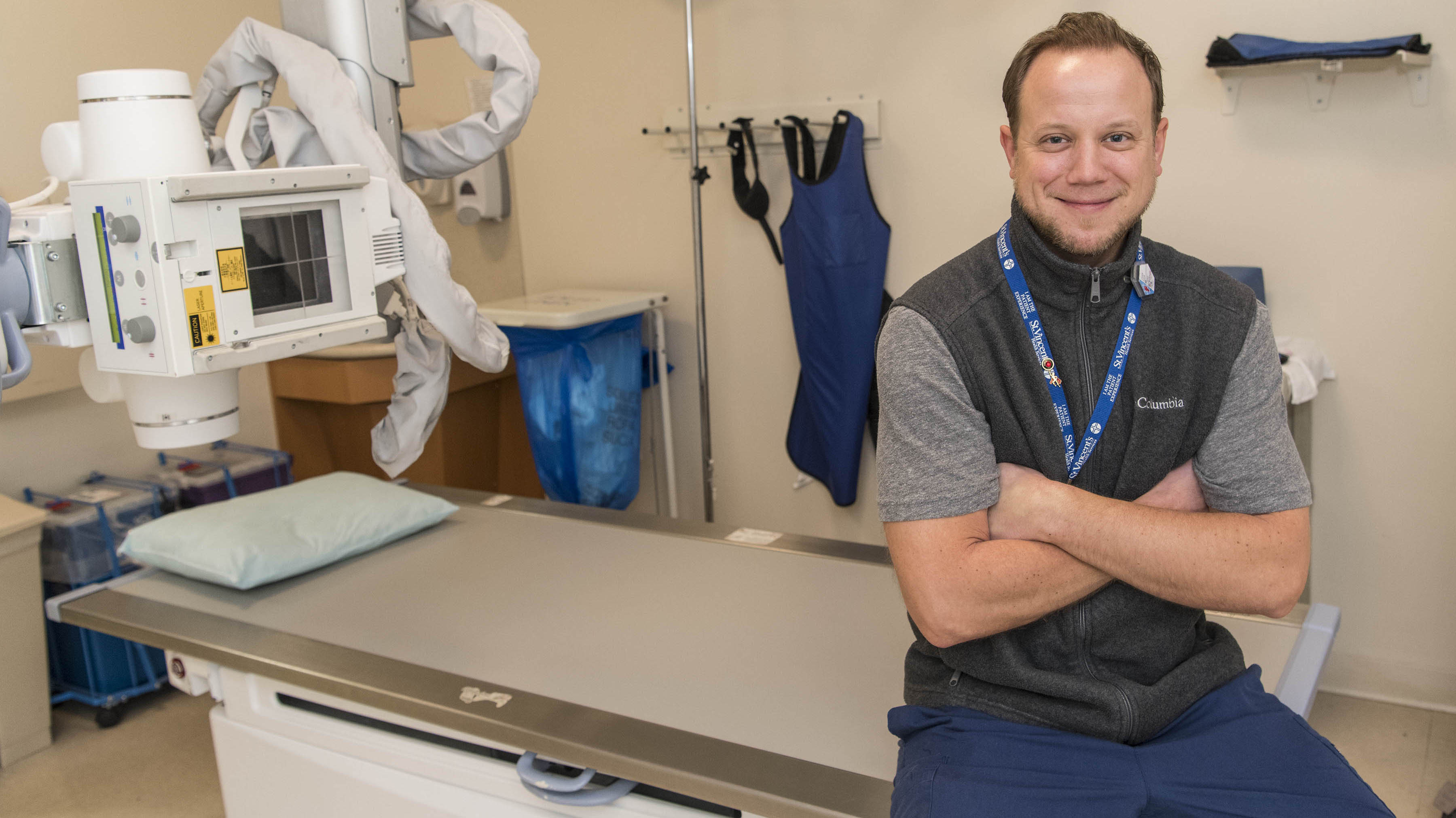 Man sitting on exam table.