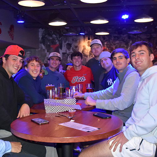 group photo of friends at a table
