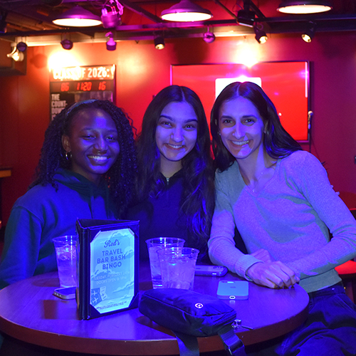 three people smiling