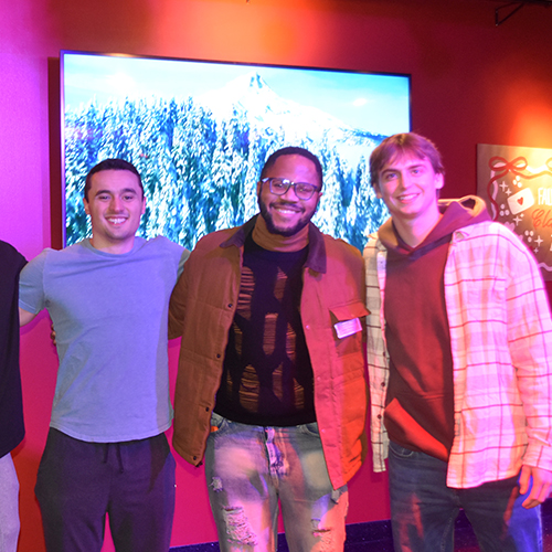 three people smiling