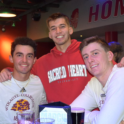 Three friends smiling