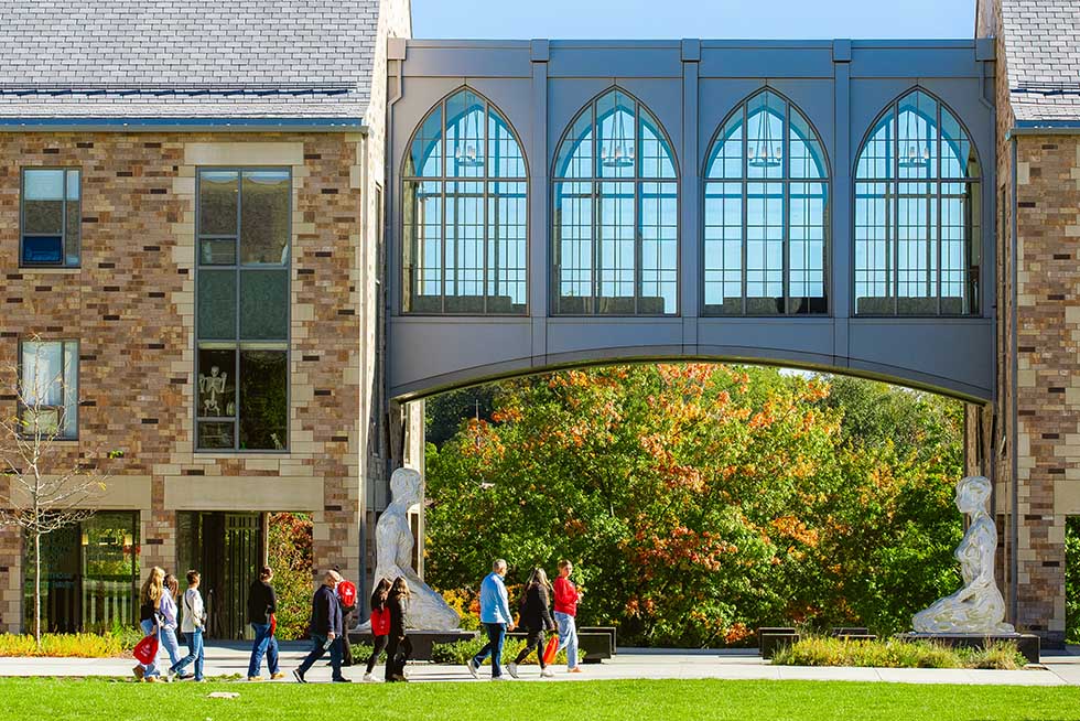 a group of people touring a college campus