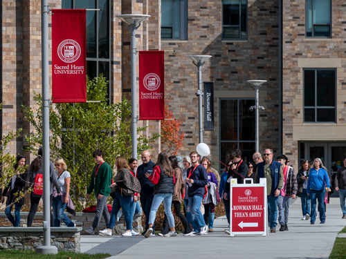 Visitors walking on campus