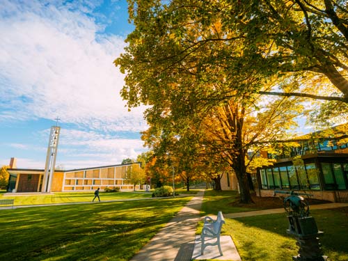 Student walking across the chapel quad