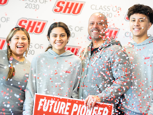 Incoming student with family celebrating