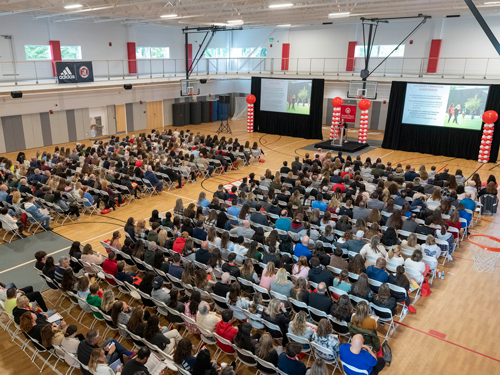 Aerial view of people at open house presentation