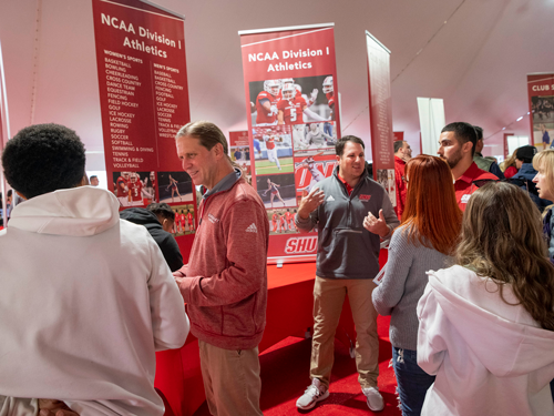 Families talking to Athletics coaches