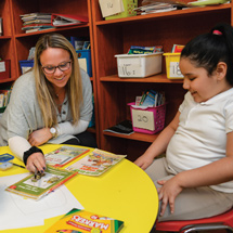 Teacher helping student with work