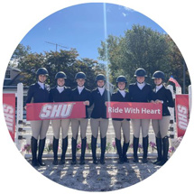Horseback riders holding 