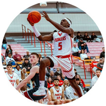 Basketball player dunking ball