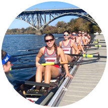 Rowing team sitting in boat