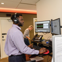 Man wearing headphones working on computer