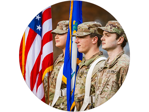 Army ROTC members with flags