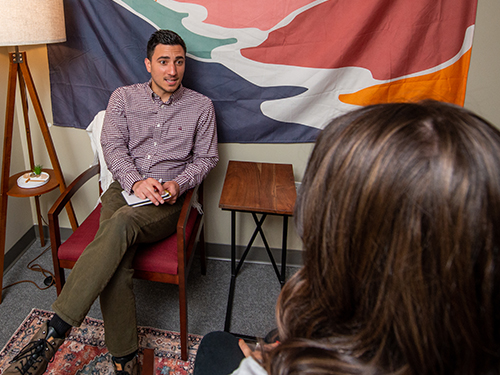 A counselor talking with a student during an appointment