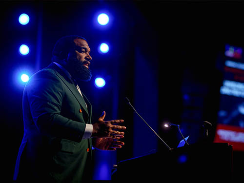 Man speaking at a podium