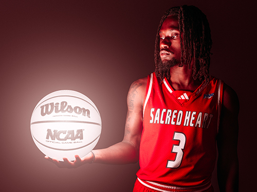 Man holding a glowing basketball