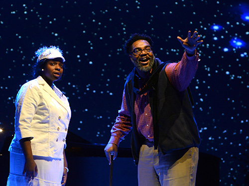 two actors on a stage with snow