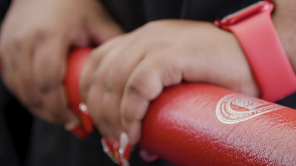 Hands holding diploma